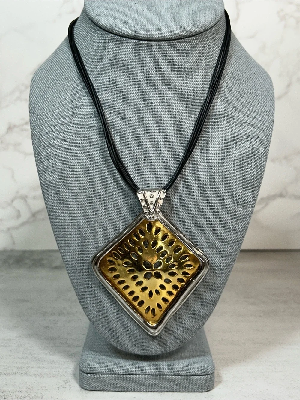 Chico's Gold and Silver Sunburst Pendant Necklace with Black Multi-Strand Cord
